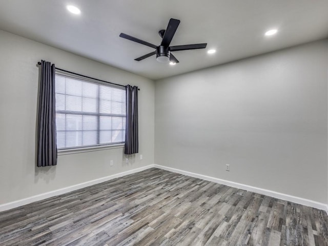 unfurnished room featuring ceiling fan and wood-type flooring