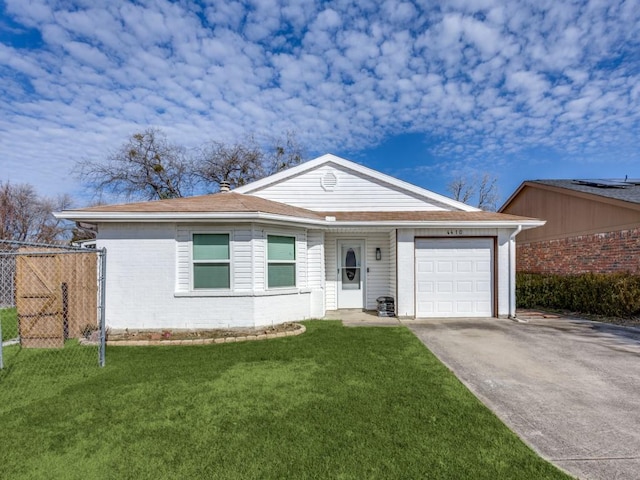 ranch-style house with a garage and a front yard