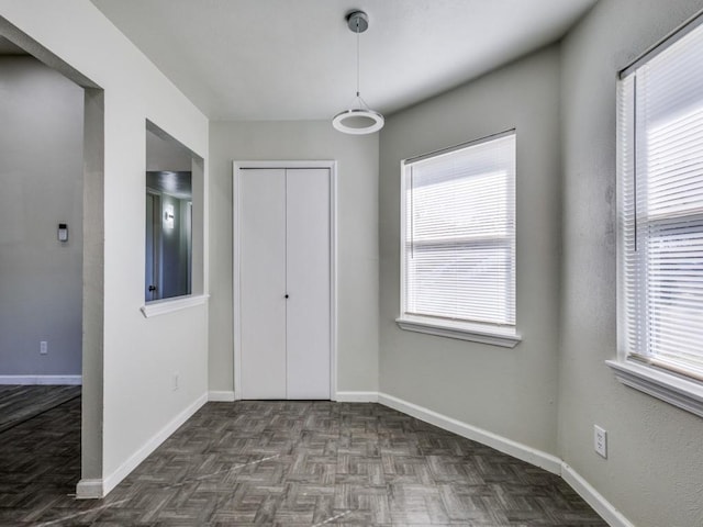 unfurnished bedroom featuring dark parquet floors