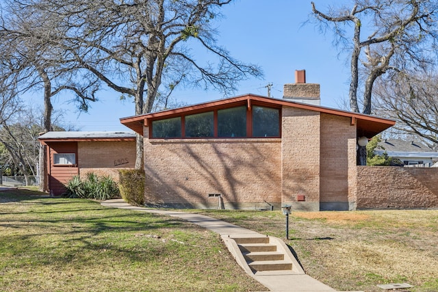 exterior space with a front yard