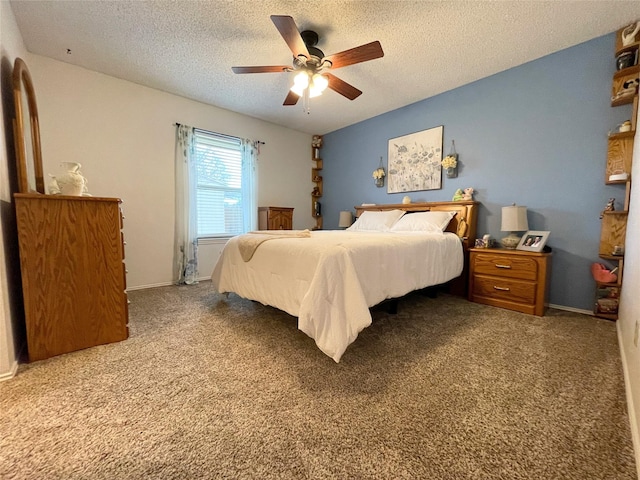 bedroom featuring carpet, a textured ceiling, and ceiling fan