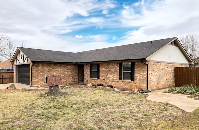 ranch-style house with a garage and a front yard