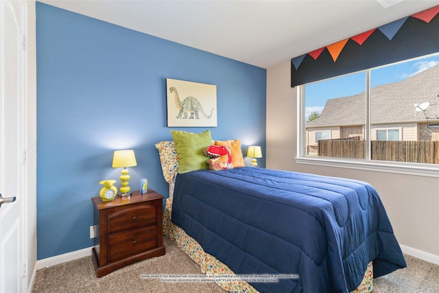 bedroom featuring carpet