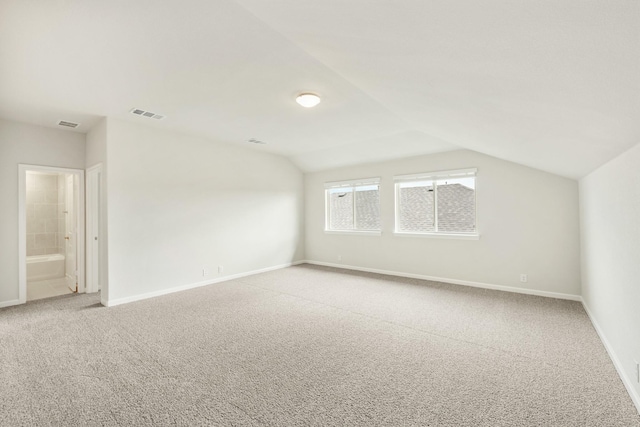 3219 Blossom Trl, Crandall, TX 75114 - additional living space featuring light carpet, baseboards, and vaulted ceiling