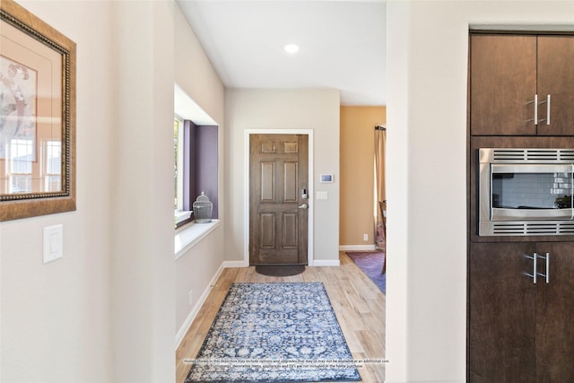 entryway with light hardwood / wood-style floors