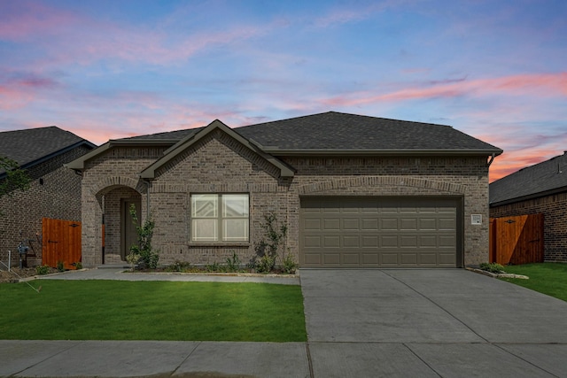 3219 Blossom Trl, Crandall, TX 75114 - french country inspired facade with driveway, brick siding, roof with shingles, and a garage