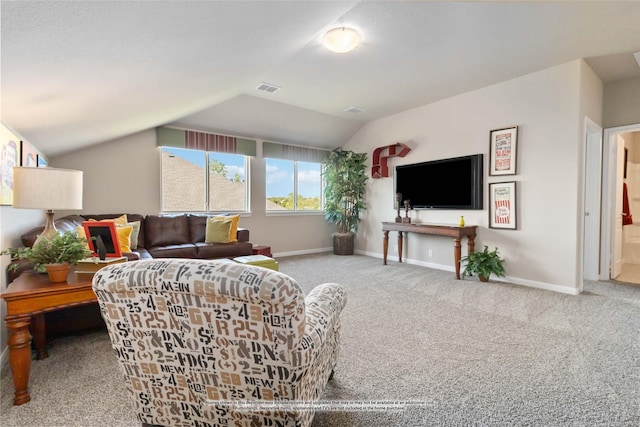 carpeted living room with vaulted ceiling