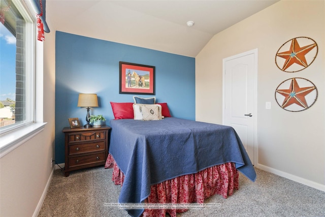 carpeted bedroom featuring vaulted ceiling