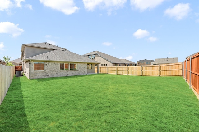 3219 Blossom Trl, Crandall, TX 75114 - rear view of house with central AC, roof with shingles, and brick siding