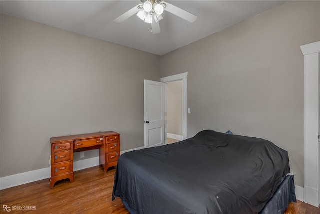 bedroom with ceiling fan and light hardwood / wood-style floors