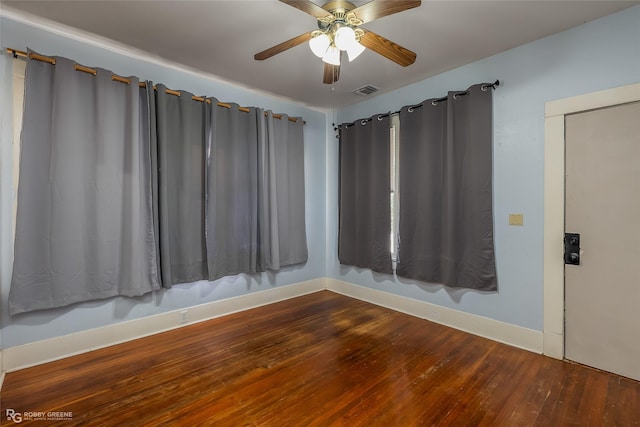 spare room featuring hardwood / wood-style flooring and ceiling fan