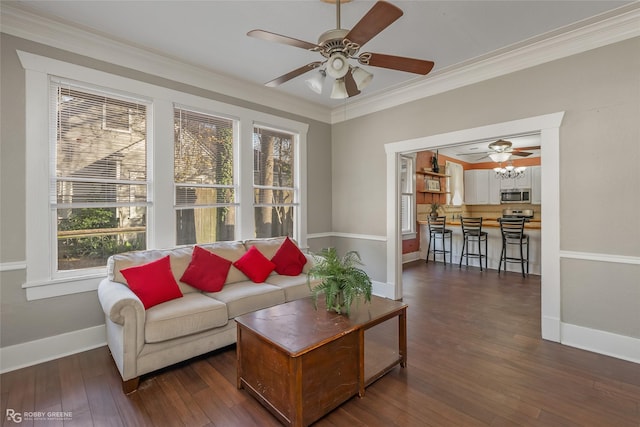 living room featuring crown molding, ceiling fan, dark wood-type flooring, and a wealth of natural light