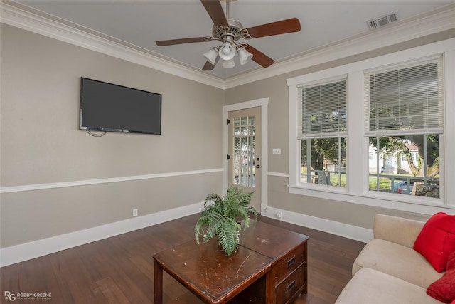 living room featuring crown molding, ceiling fan, and dark wood-type flooring