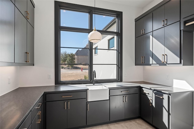 kitchen with dark countertops and a sink