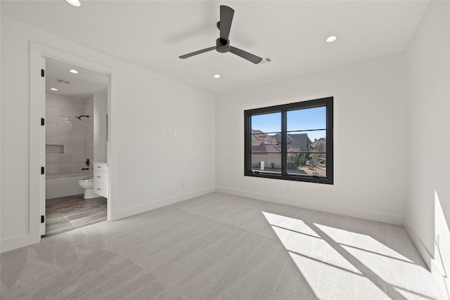 unfurnished bedroom featuring recessed lighting, visible vents, baseboards, and light carpet