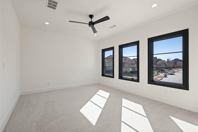 unfurnished room featuring visible vents, recessed lighting, baseboards, and ceiling fan