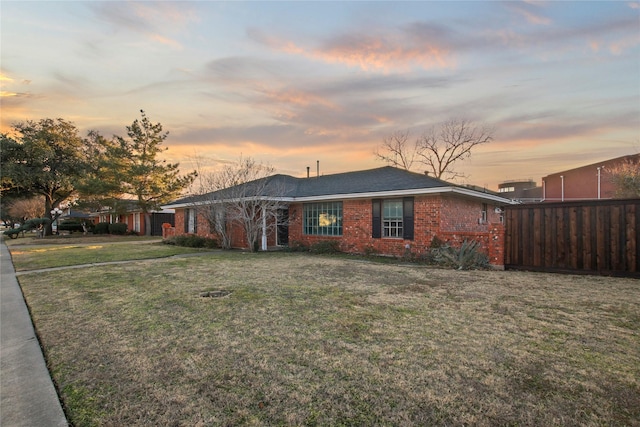 ranch-style house featuring a yard