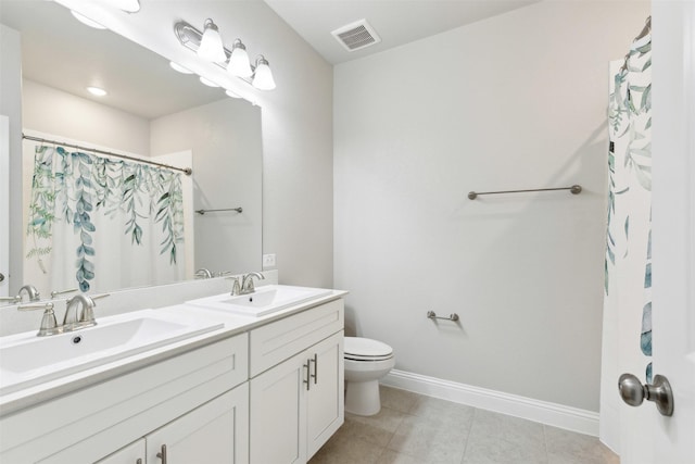 bathroom with baseboards, visible vents, a sink, and toilet