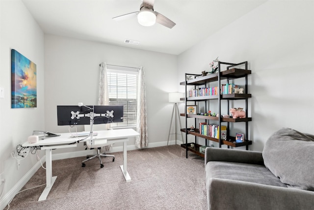 office space with ceiling fan, carpet floors, visible vents, and baseboards