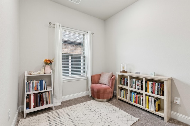 sitting room with carpet floors and baseboards