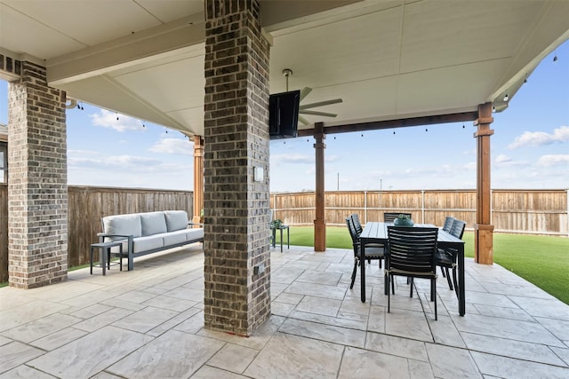 view of patio with a fenced backyard and outdoor dining space