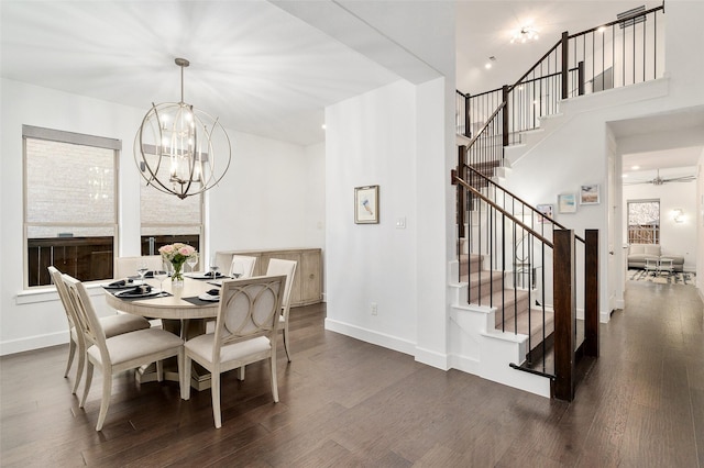 dining area featuring an inviting chandelier and dark hardwood / wood-style floors