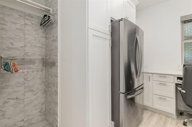 laundry room with light hardwood / wood-style floors