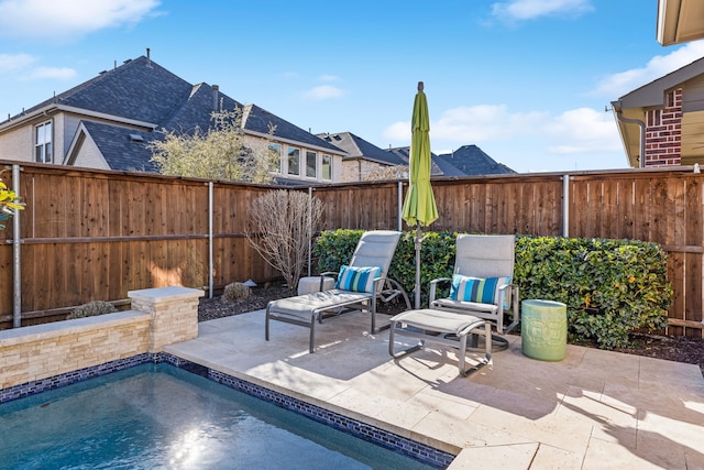 view of patio with a fenced in pool