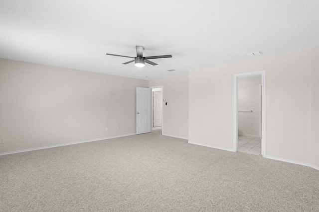 carpeted empty room with ceiling fan