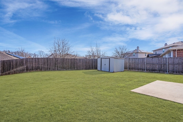 view of yard featuring a storage shed and a patio