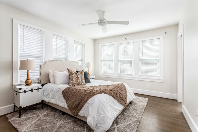 bedroom featuring dark hardwood / wood-style flooring and ceiling fan