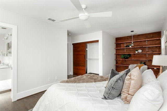 bedroom with hardwood / wood-style flooring, a closet, and ceiling fan