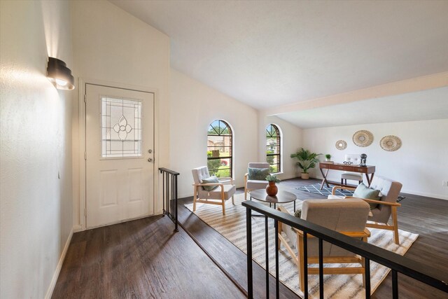 sitting room with hardwood / wood-style flooring and vaulted ceiling