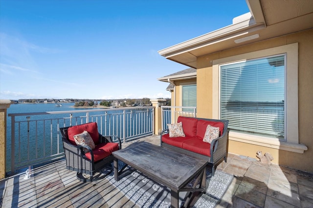 balcony featuring a water view