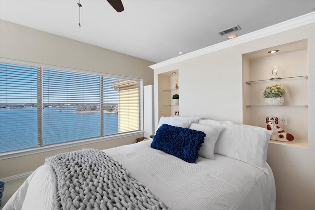 bedroom featuring crown molding, a water view, and ceiling fan