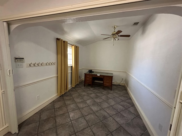 empty room with lofted ceiling and ceiling fan