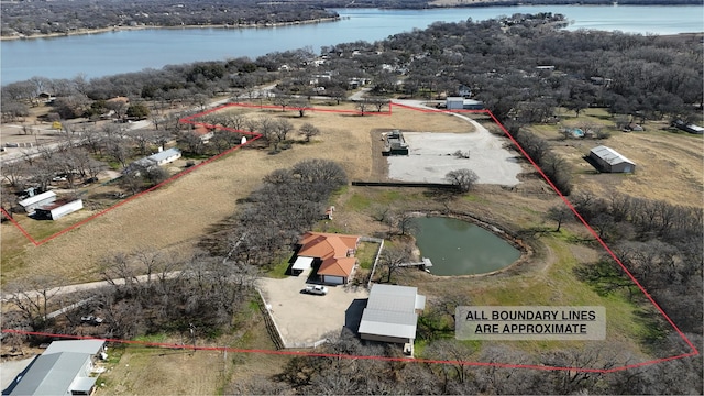 drone / aerial view featuring a water view