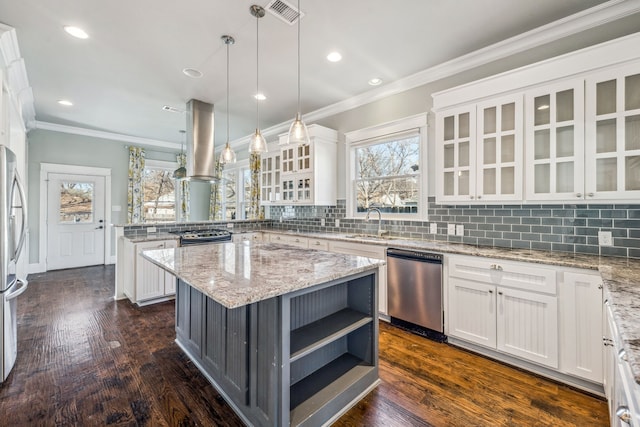 kitchen featuring white cabinetry, a center island, hanging light fixtures, island exhaust hood, and stainless steel appliances