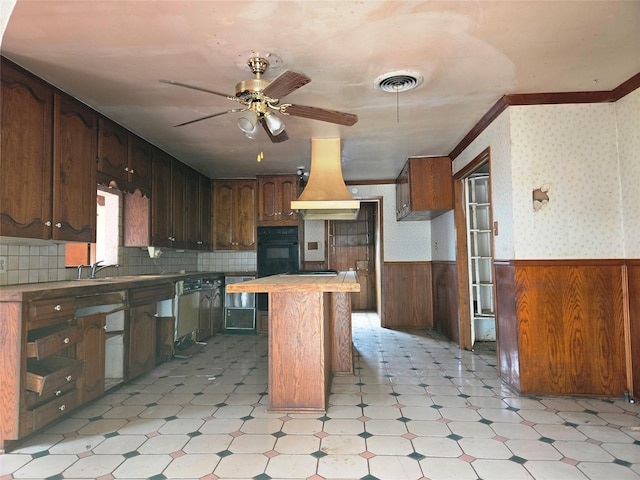 kitchen with crown molding, ceiling fan, and sink