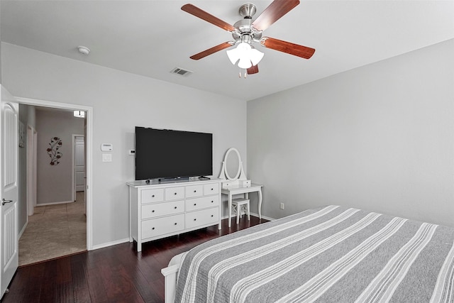 bedroom featuring dark hardwood / wood-style flooring and ceiling fan