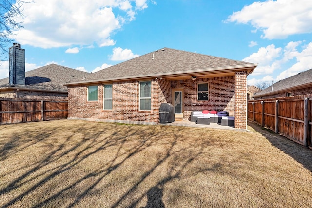 rear view of house featuring an outdoor living space, a patio area, ceiling fan, and a lawn