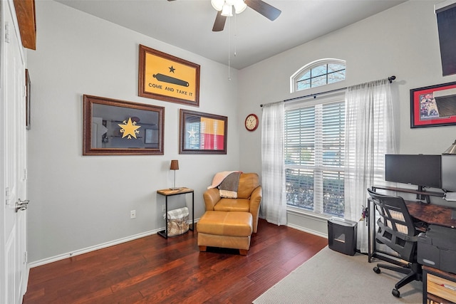 office space featuring a healthy amount of sunlight, dark wood-type flooring, and ceiling fan