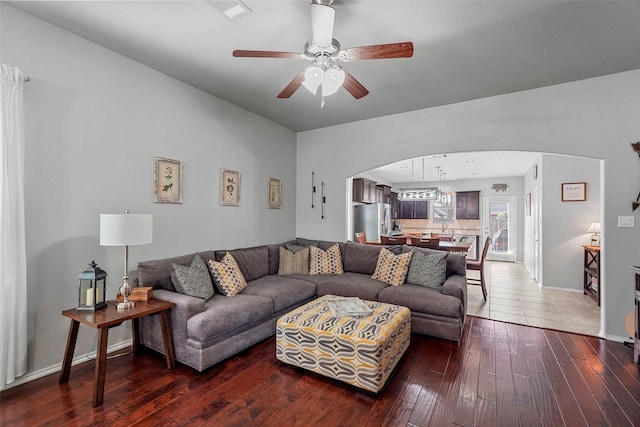 living room with hardwood / wood-style floors and ceiling fan