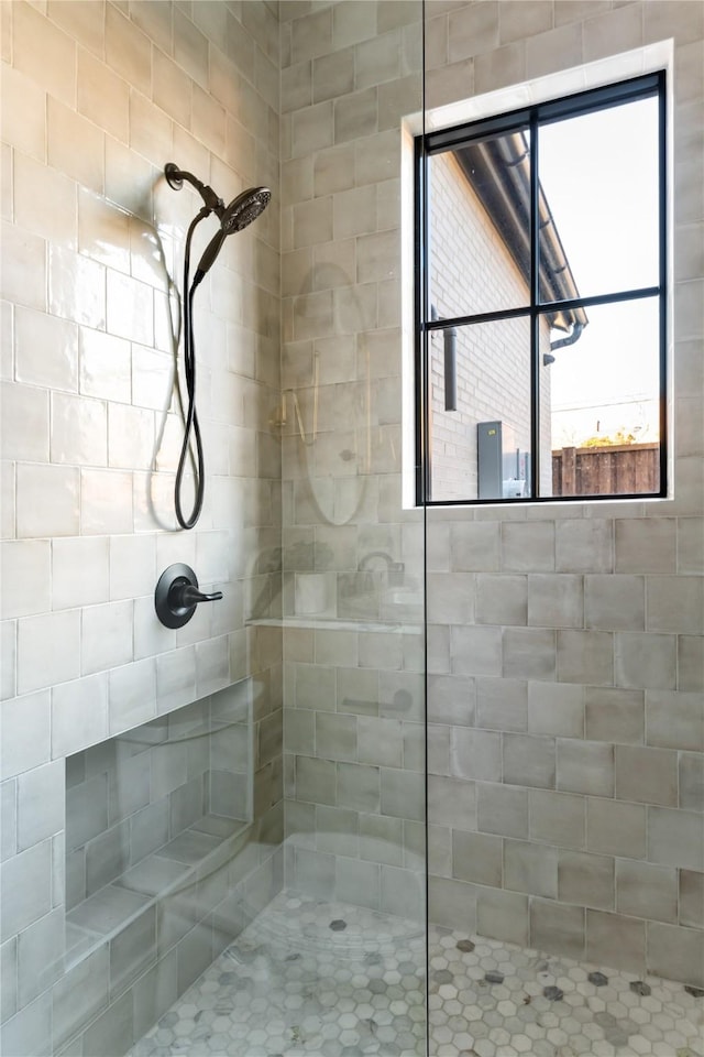 bathroom with a tile shower