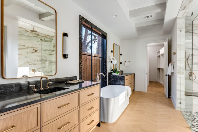 bathroom featuring vanity and a shower with shower door