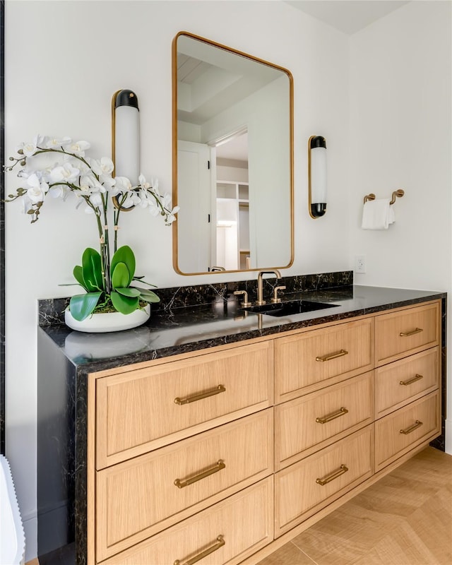 bathroom featuring vanity and hardwood / wood-style floors