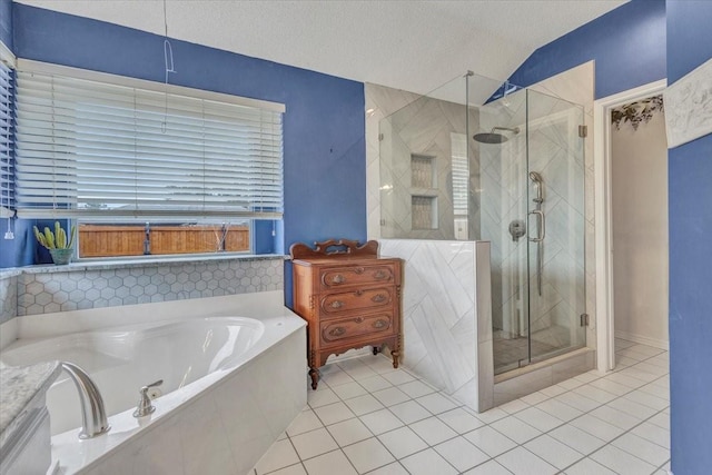 bathroom featuring lofted ceiling, separate shower and tub, tile patterned flooring, and a textured ceiling