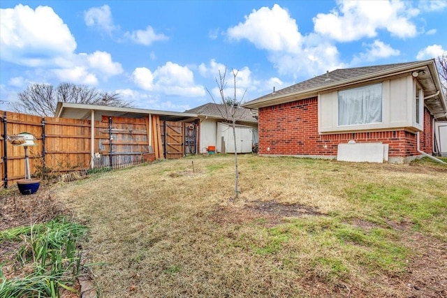 rear view of house with a lawn