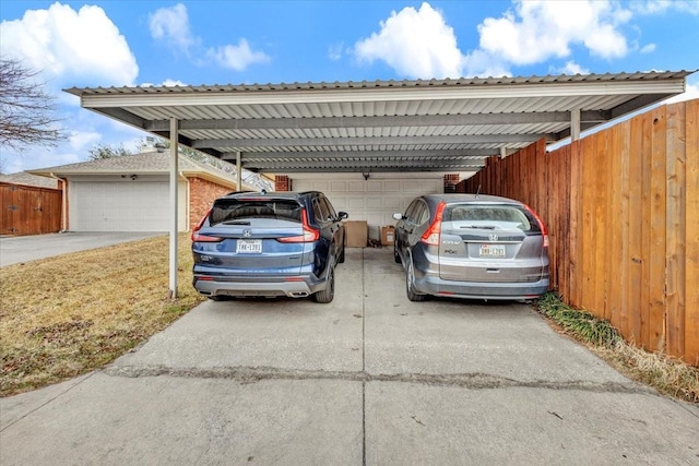 view of vehicle parking featuring a garage and a carport