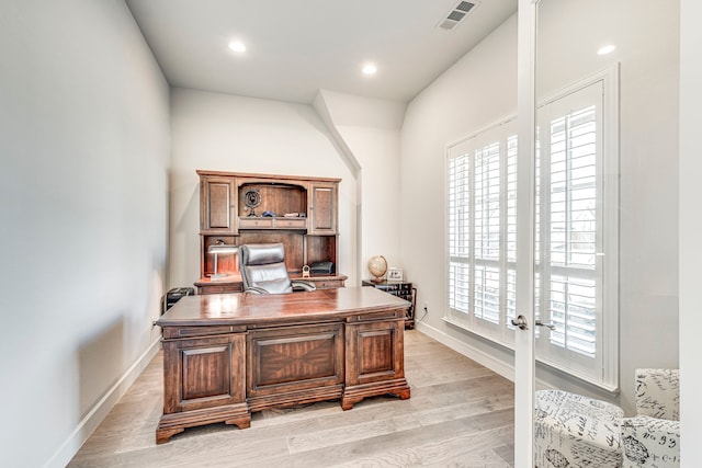 office space with light wood-type flooring and french doors